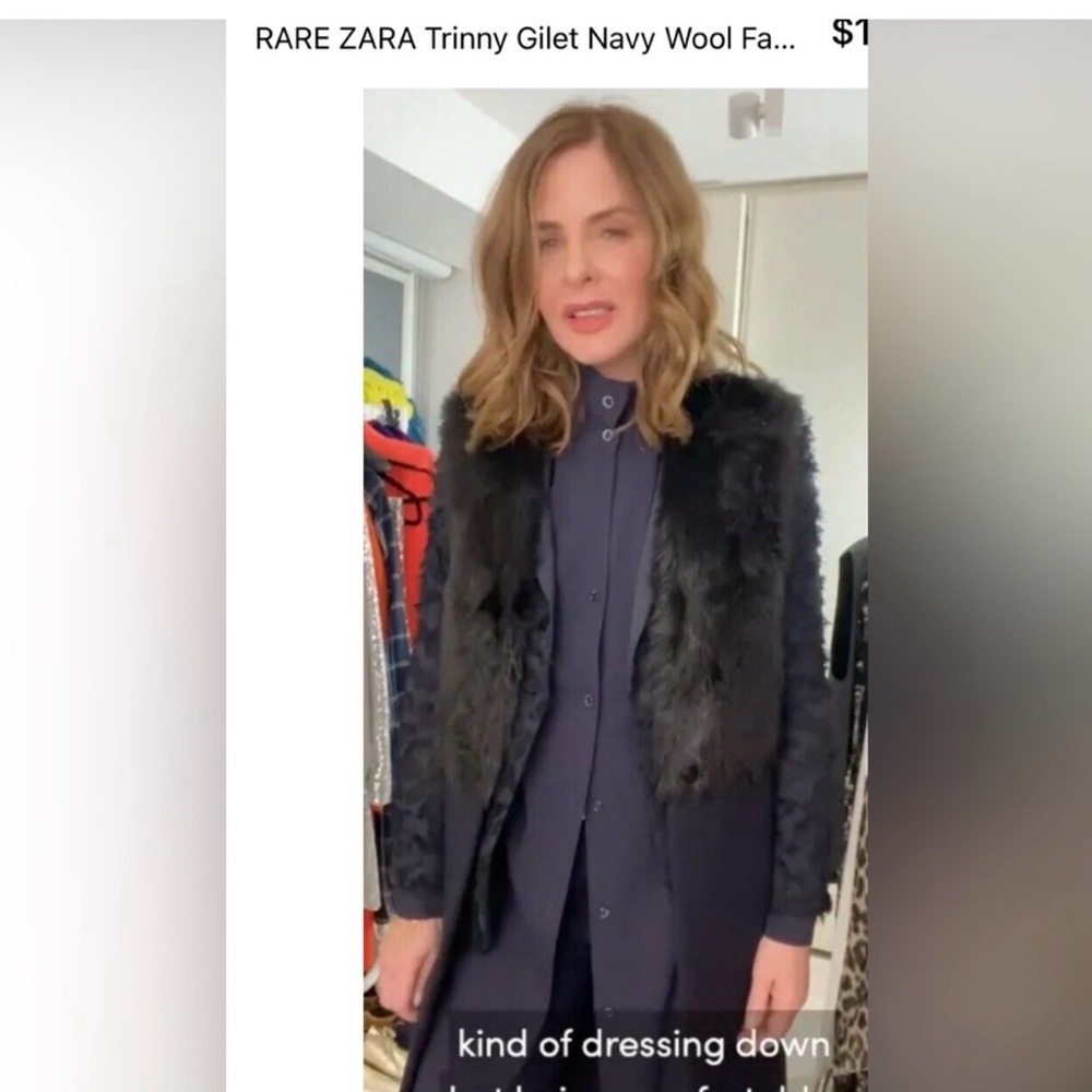 Top front is black faux fur and the rest of the vest is navy blue